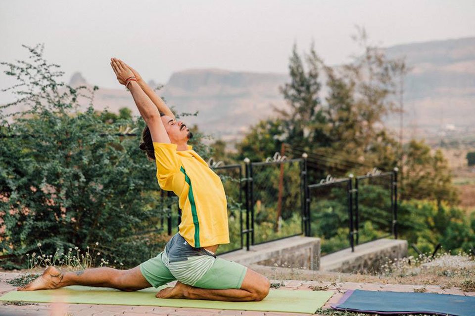 TTC Student Practising Warrior Thunderbolt Pose at Yoga Vidya Dham 