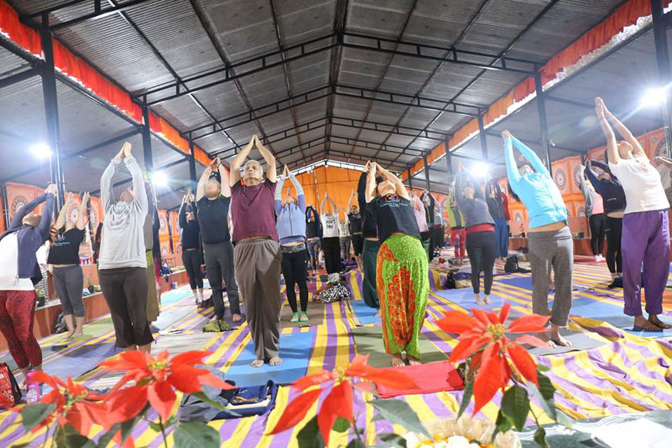 Yoga Students Preactising Yoga at YogaPoint Yoga Teacher Training Classroom 